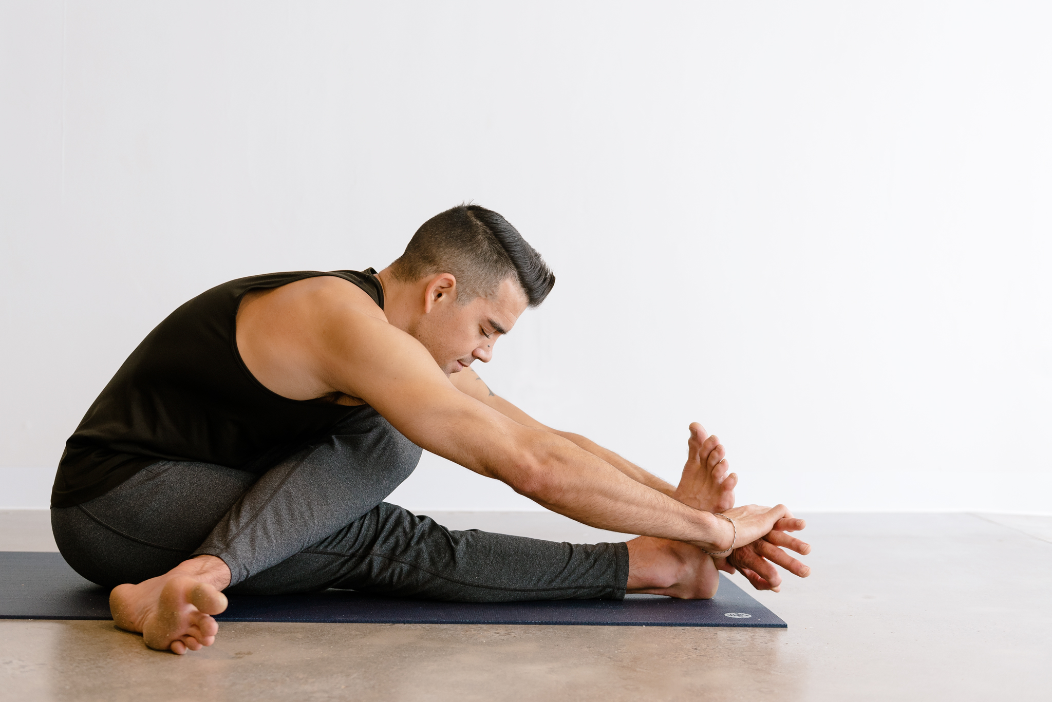 Yoga teacher Dustin Brown in a yin posture at warrior one yoga studio in Mordialloc