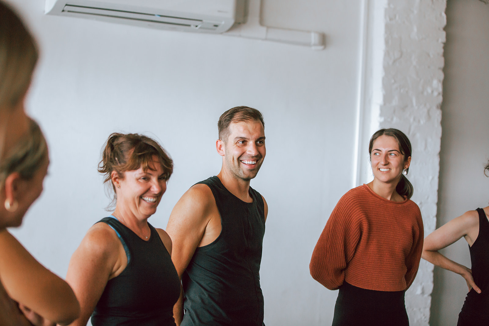 a group of students smiling at warrior one yoga 200 hour vinyasa teacher training in mordialloc